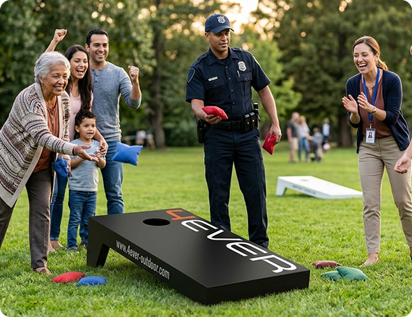 Community members playing cornhole with a police officer in a park